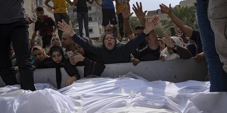 Relatives mourn people killed in an Israeli air strike in Gaza City on Monday, Oct. 9, 2023. (Photo | AP)